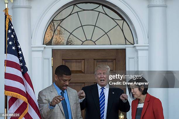 President-elect Donald Trump emerges from the clubhouse with Kevin Johnson and Michelle Rhee after their meeting at Trump International Golf Club,...