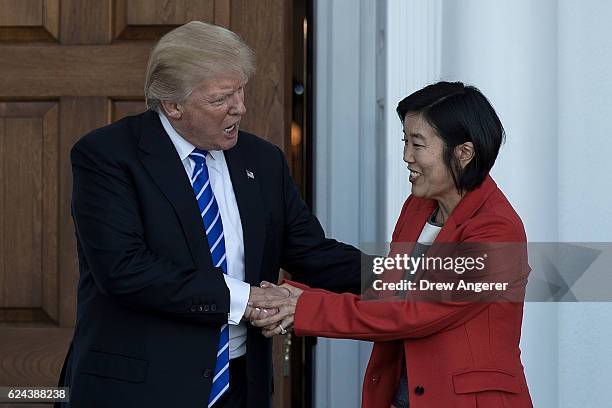 President-elect Donald Trump shakes hands with Michelle Rhee after their meeting at Trump International Golf Club, November 19, 2016 in Bedminster...