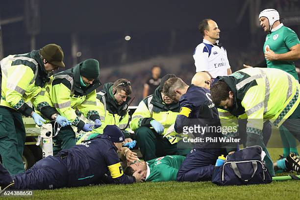 Robbie Henshaw of Ireland is taken from the field injured during the international rugby match between Ireland and the New Zealand All Blacks at...