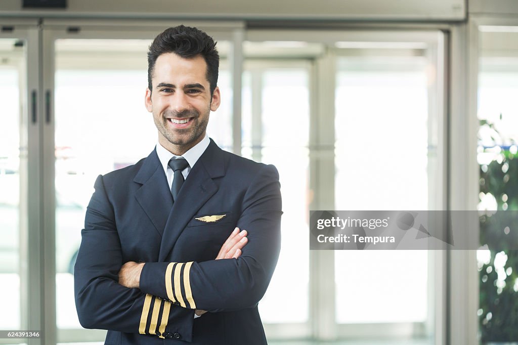Aeroplane pilot looking at camera and smiling.
