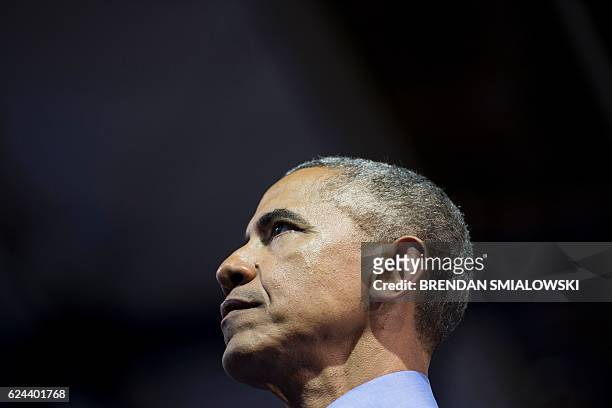 President Barack Obama pauses while speaking during a Young Leaders of the Americas Initiative town hall meeting at the Pontifical Catholic...