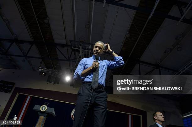 President Barack Obama waits to answer a question during a Young Leaders of the Americas Initiative town hall meeting at the Pontifical Catholic...