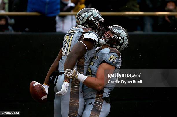 Jarvion Franklin and Donnie Ernsberger of the Western Michigan Broncos celebrate after Franklin scored a touchdown in the second quarter against the...