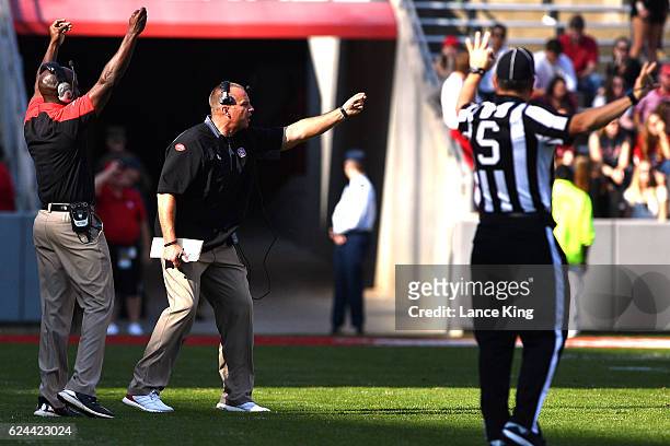 Head coach Dave Doeren of the North Carolina State Wolfpack directs his team during their game against the Miami Hurricanes at Carter-Finley Stadium...
