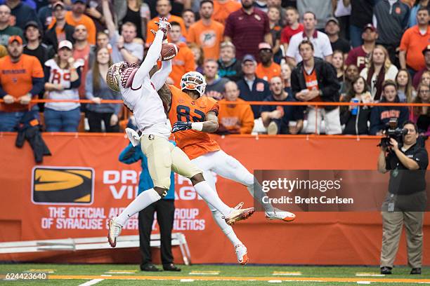 Tarvarus McFadden of the Florida State Seminoles breaks up a pass intended for Alvin Cornelius of the Syracuse Orange during the first half on...