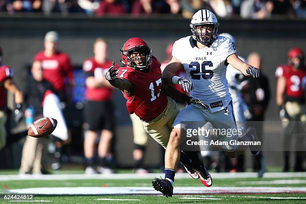 Justice Shelton-Mosley of the Harvard Crimson reaches for a pass in the second quarter of a game against the Yale Bulldogs at Harvard Stadium on...