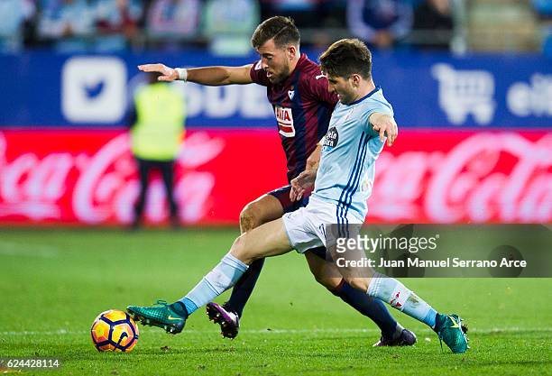 Sergi Enrich of SD Eibar duels for the ball with Carles Planas of RC Celta de Vigo during the La Liga match between SD Eibar and RC Celta de Vigo at...