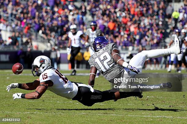 Chris Lacy of the Oklahoma State Cowboys dives for a pass against Jeff Gladney of the TCU Horned Frogs in the first half at Amon G. Carter Stadium on...