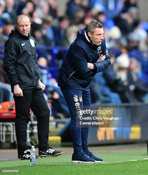 Millwall manager Neil Harris shouts instructions to his team from the dug-out during the Sky Bet League One match between Bolton Wanderers and...