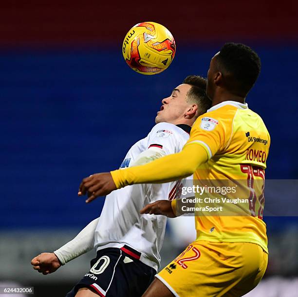 Bolton Wanderers' Zach Clough vies for possession with Millwall's Mahlon Romeo during the Sky Bet League One match between Bolton Wanderers and...