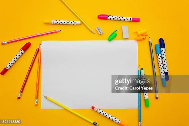 paper and color pens in a yellow background - school tie stock pictures, royalty-free photos & images