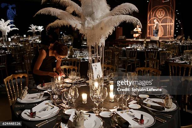 Girl lights candles before the 20th Luxembourg Red Cross Ball Gala on November 19, 2016 in Luxembourg, Luxembourg.