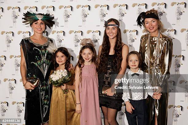 Florence Reckinger-Taddeï and family pose for photocall as they arrive for the 20th Luxembourg Red Cross Ball Gala on November 19, 2016 in...