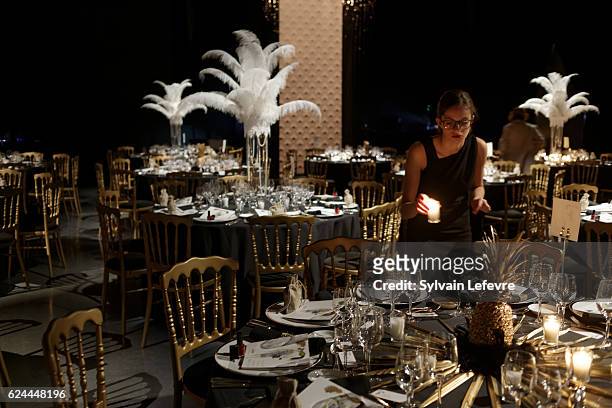 Girl lights candles before the 20th Luxembourg Red Cross Ball Gala on November 19, 2016 in Luxembourg, Luxembourg.