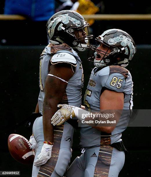 Jarvion Franklin and Donnie Ernsberger of the Western Michigan Broncos celebrate after Franklin scored a touchdown in the second quarter against the...