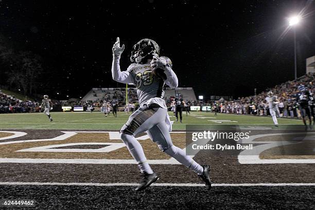 Michael Henry of the Western Michigan Broncos scores a touchdown in the third quarter against the Buffalo Bulls at Waldo Stadium on November 19, 2016...