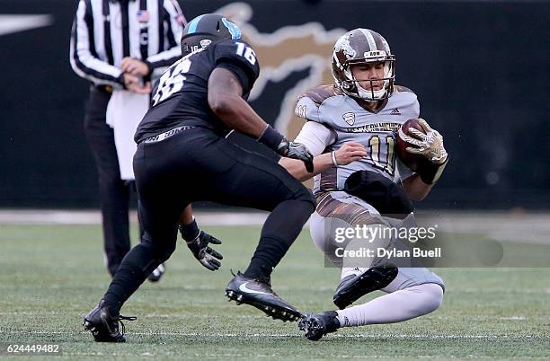 Zach Terrell of the Western Michigan Broncos slides in front of Ishmael Hargrove of the Buffalo Bulls in the second quarter at Waldo Stadium on...