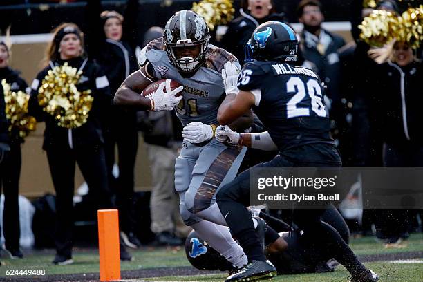 Jarvion Franklin of the Western Michigan Broncos scores a touchdown past Ryan Williamson of the Buffalo Bulls in the second quarter at Waldo Stadium...