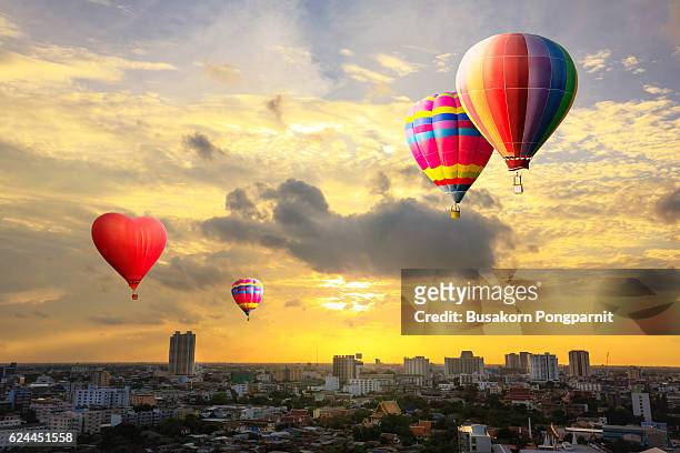 colorful hot air balloon is flying - hot air balloon ride stock pictures, royalty-free photos & images