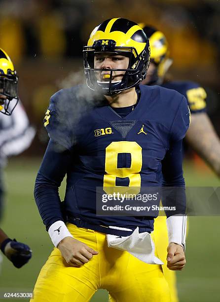 John O'Korn of the Michigan Wolverines reacts to a second half run while playing the Indiana Hoosiers on November 19, 2016 at Michigan Stadium in Ann...