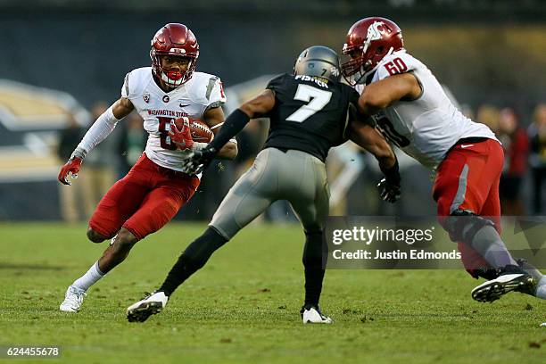 Wide receiver Tavares Martin Jr. #8 of the Washington State Cougars runs with the ball after making a catch for a first down during the fourth...