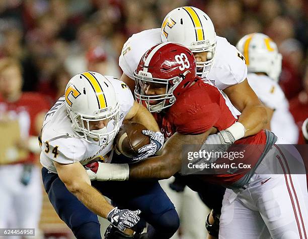 Jonathan Allen of the Alabama Crimson Tide tackles Derrick Craine of the Chattanooga Mocs at Bryant-Denny Stadium on November 19, 2016 in Tuscaloosa,...