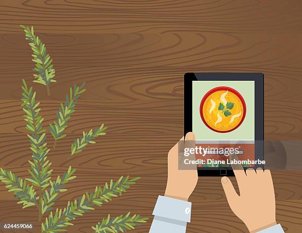 cooking background with herbs on a table - ipad on table stock illustrations