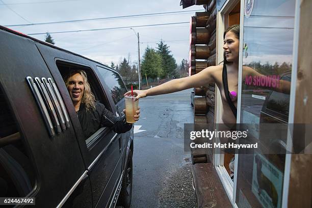 Singer Michael Starr of Steel Panther stops for coffee at bikini coffee stand Hillbilly Hotties before performing at Showbox SoDo on November 19,...