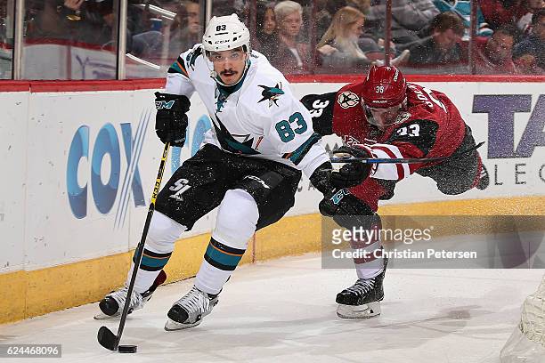 Matt Nieto of the San Jose Sharks skates with the puck past Alex Goligoski of the Arizona Coyotes during the second period of the NHL game at Gila...