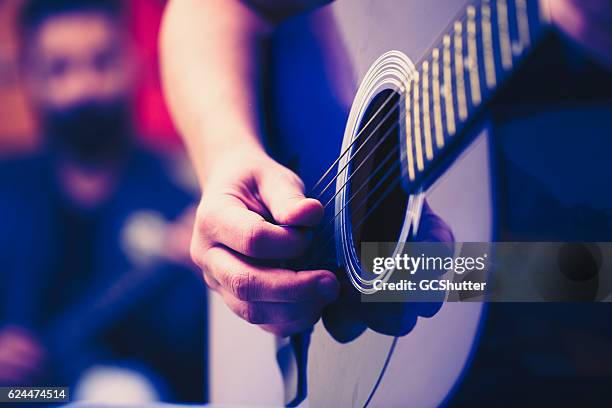 tell me if i go off key please. - guitarist band stock pictures, royalty-free photos & images