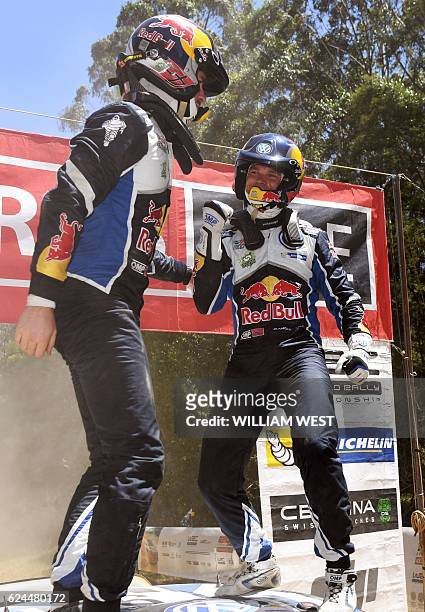 Driver Andreas Mikkelsen of Norway celebrates with co-driver Anders Jaeger Synnevag after winning the Rally Australia in their Volkswagen Polo WRC...