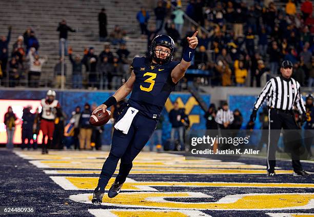 Skyler Howard of the West Virginia Mountaineers celebrate his 6 yard second half touchdown against the Oklahoma Sooners on November 19, 2016 at...