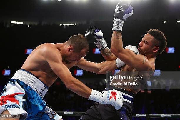 Andre Ward and Sergey Kovalev of Russia trade punches during the first round of their light heavyweight title bout at T-Mobile Arena on November 19,...