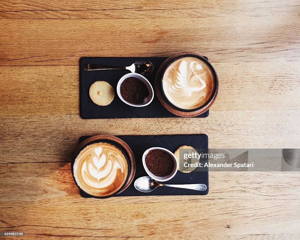 Overhead view of symmetric coffee cups for two persons