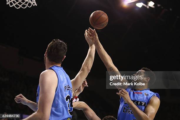 Ogilvy of the Hawks and Corey Webster of the Breakers compete for the ball during the round seven NBL match between the Illawarra Hawks and the New...
