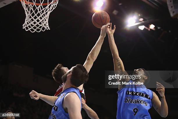 Ogilvy of the Hawks and Corey Webster of the Breakers compete for the ball during the round seven NBL match between the Illawarra Hawks and the New...