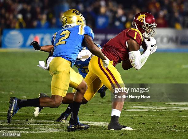 Wide receiver Darreus Rogers of the USC Trojans makes a 15 yard reception in front of defensive back Jaleel Wadood of the UCLA Bruins during the...