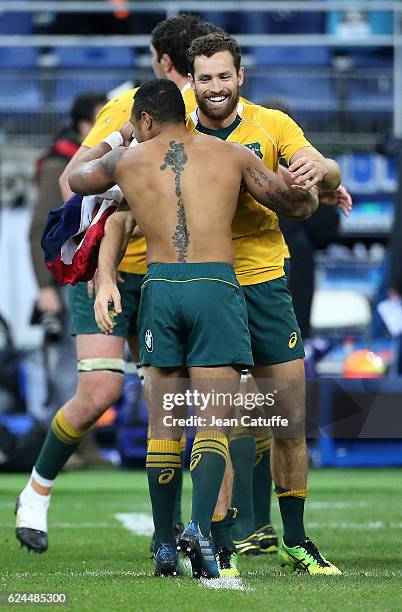 Will Genia and Luke Morahan of Australia celebrate the victory following the international friendly test match between France and Australia at Stade...