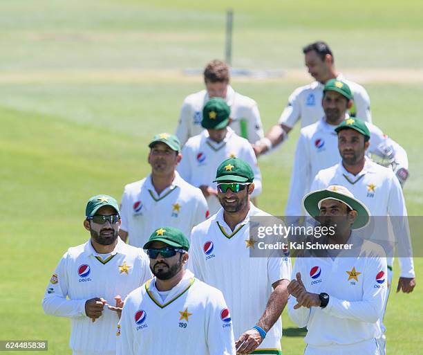 Pakistan walk from the ground after their defeat during day four of the First Test between New Zealand and Pakistan at Hagley Oval on November 20,...