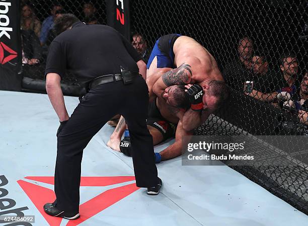 Ryan Bader of the United States attempts to submit Antonio Rogerio Nogueira of Brazil during their light heavyweight bout at UFC Fight Night Bader v...