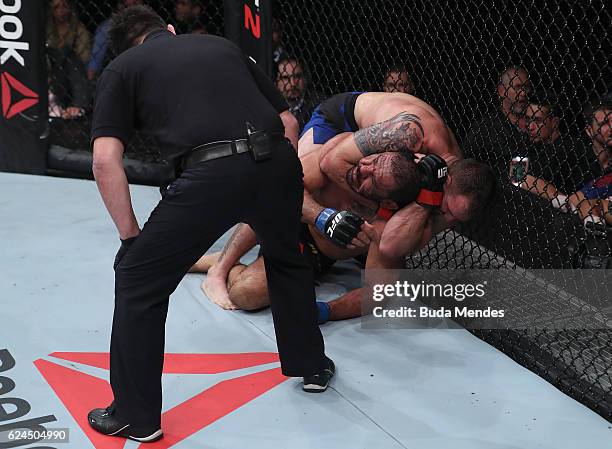 Ryan Bader of the United States attempts to submit Antonio Rogerio Nogueira of Brazil during their light heavyweight bout at UFC Fight Night Bader v...