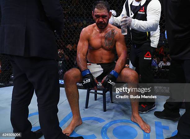 Antonio Rogerio Nogueira of Brazil receives medical attention during his light heavyweight bout against Ryan Bader of the United States at the UFC...