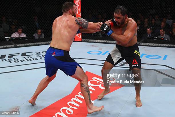 Ryan Bader of the United States and Antonio Rogerio Nogueira of Brazil exchange punches during their light heavyweight bout at UFC Fight Night Bader...