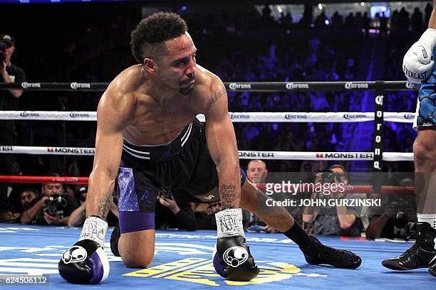 Andre Ward the US is sent to the canvas by Sergey Kovalev of Russia late in the second round during their WBA, IBF and WBO lightheavyweight world...