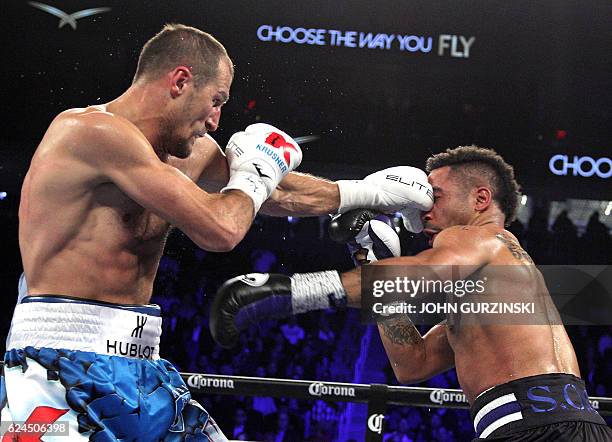 Andre Ward of the US is on the receiving end against Sergey Kovalev of Russia during their WBA, IBF and WBO lightheavyweight world championship fight...