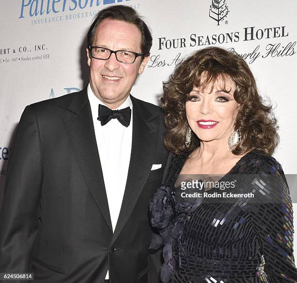 Dame Joan Collins and Percy Gibson attend Talk Of The Town Gala 2016 at The Beverly Hilton Hotel on November 19, 2016 in Beverly Hills, California.