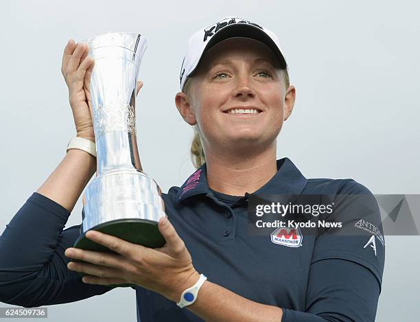 United Kingdom - U.S. Golfer Stacy Lewis holds the winner's trophy after winning the Ricoh British Women's Open in St. Andrews, Scotland, on Aug. 4,...