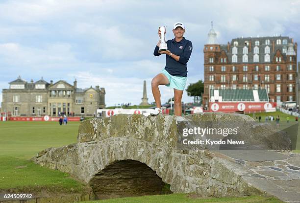 United Kingdom - U.S. Golfer Stacy Lewis holds the winner's trophy after winning the Ricoh British Women's Open in St. Andrews, Scotland, on Aug. 4,...