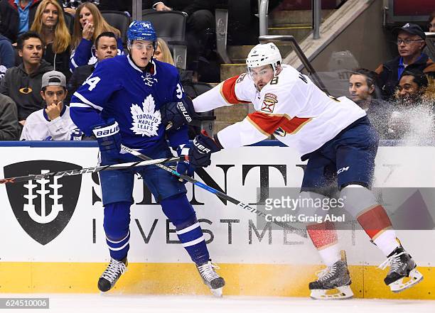 Dylan McIlrath of the Florida Panthers shoves Auston Matthews of the Toronto Maple Leafs during the first period at the Air Canada Centre on November...