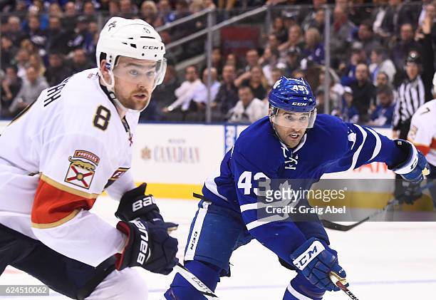 Nazem Kadri of the Toronto Maple Leafs plays against Dylan McIlrath of the Florida Panthers during the third period at the Air Canada Centre on...